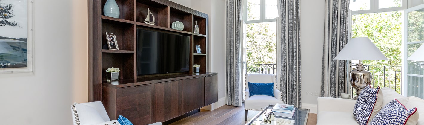 The luxury interior layout of a living room with french doors open to outdoor space